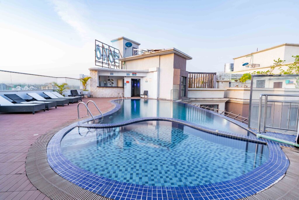 ooftop heated infinity swimming pool with Nairobi skyline views at Soho Apartments.