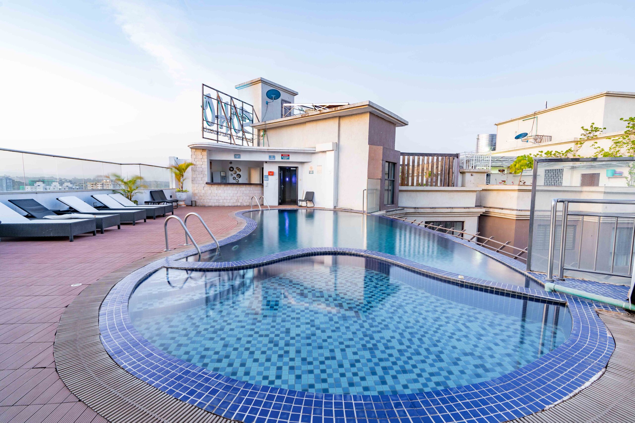 ooftop heated infinity swimming pool with Nairobi skyline views at Soho Apartments.
