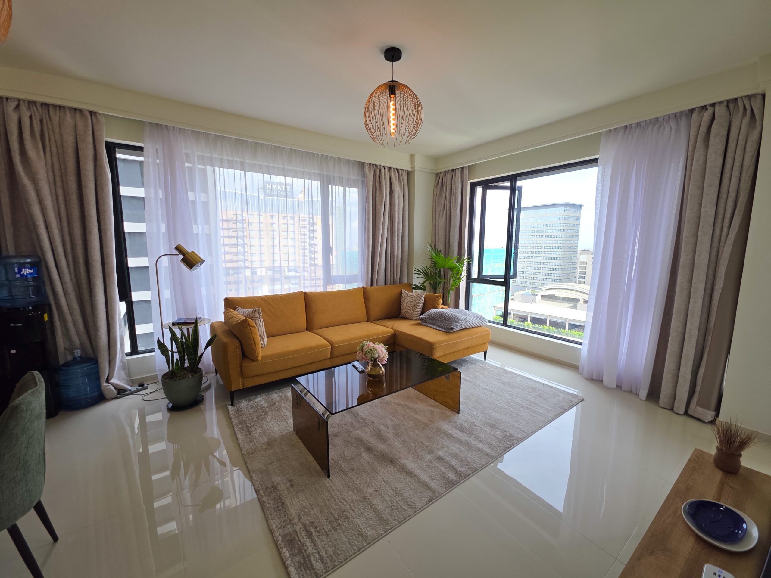 Luxury furnished apartment in Westlands at Misty Springs featuring a modern living room and city view.