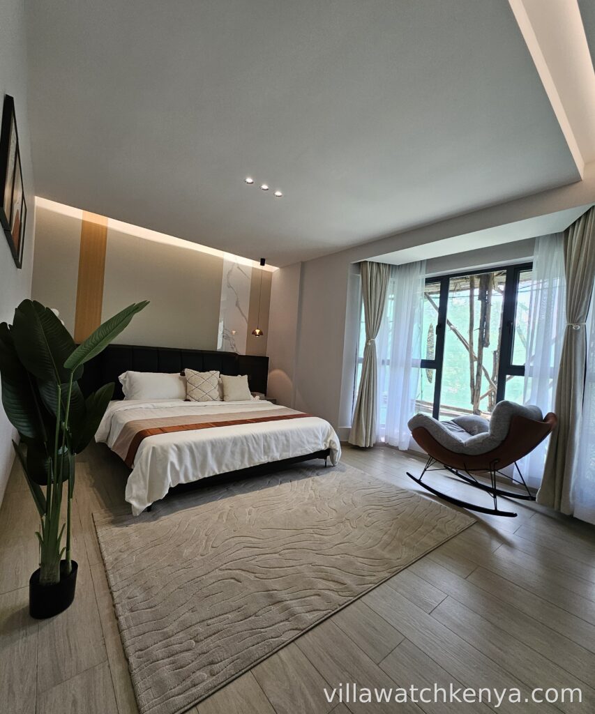 Elegant bedroom with balcony in Golfscape Residences 2-bedroom apartment